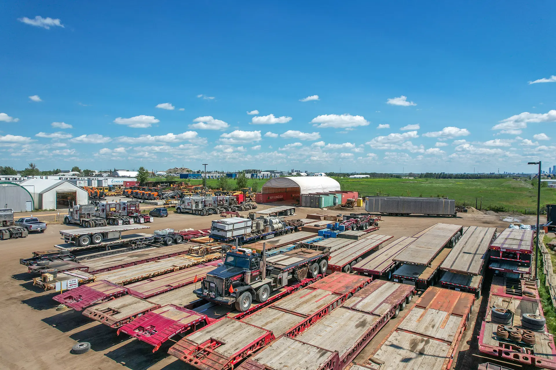 an overhead picture of a yard with trucks and equipment