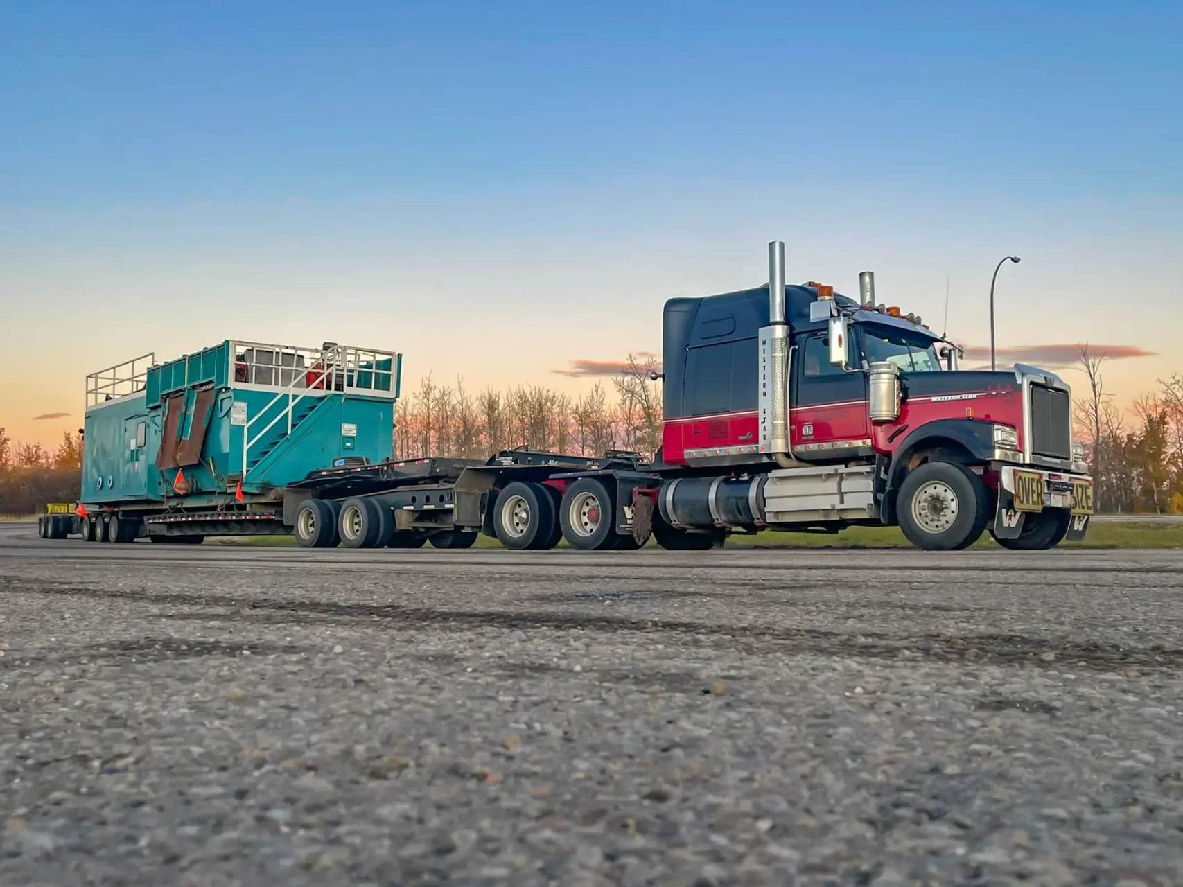 a transport truck hauling oilfield equipment